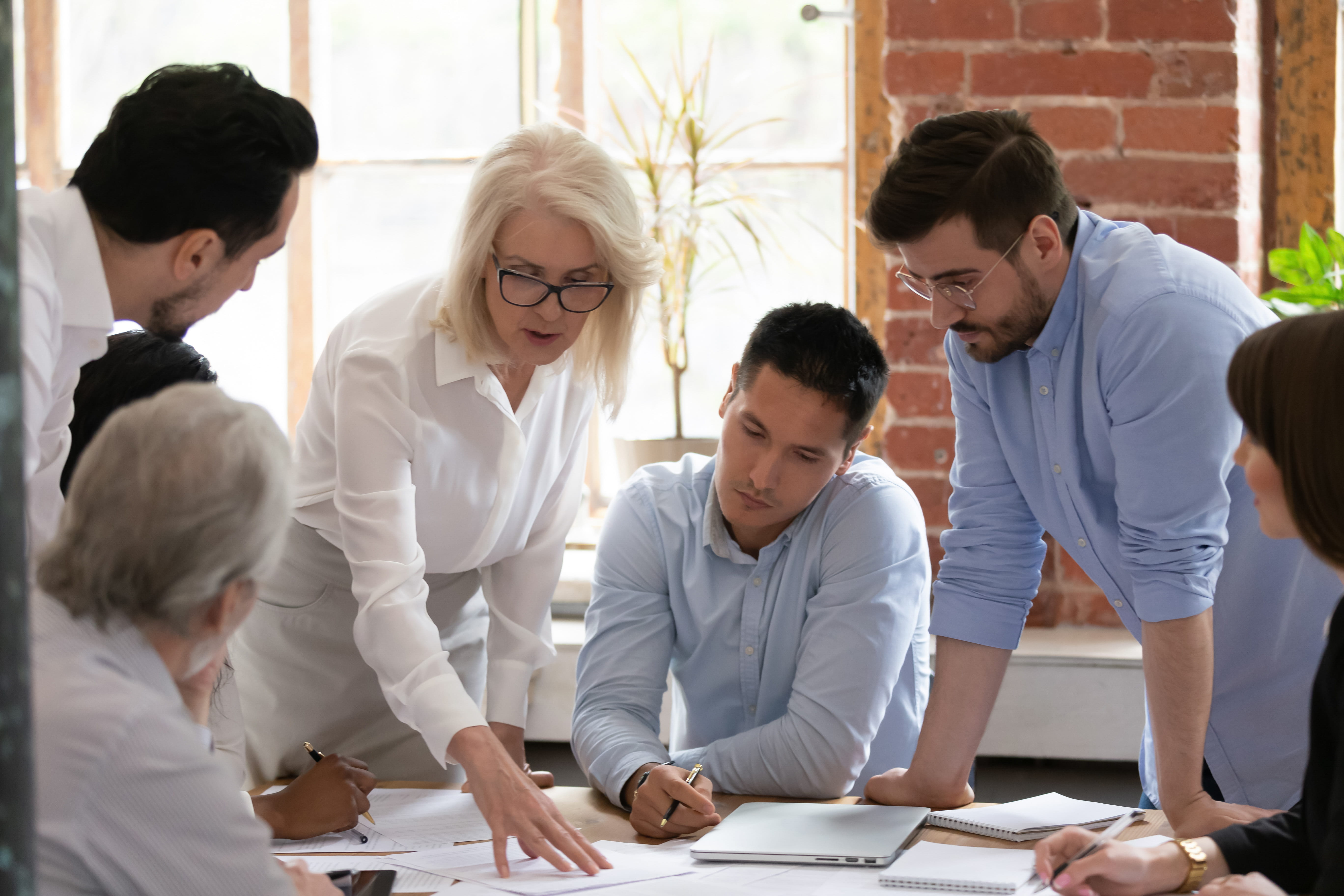 Group of associates talking