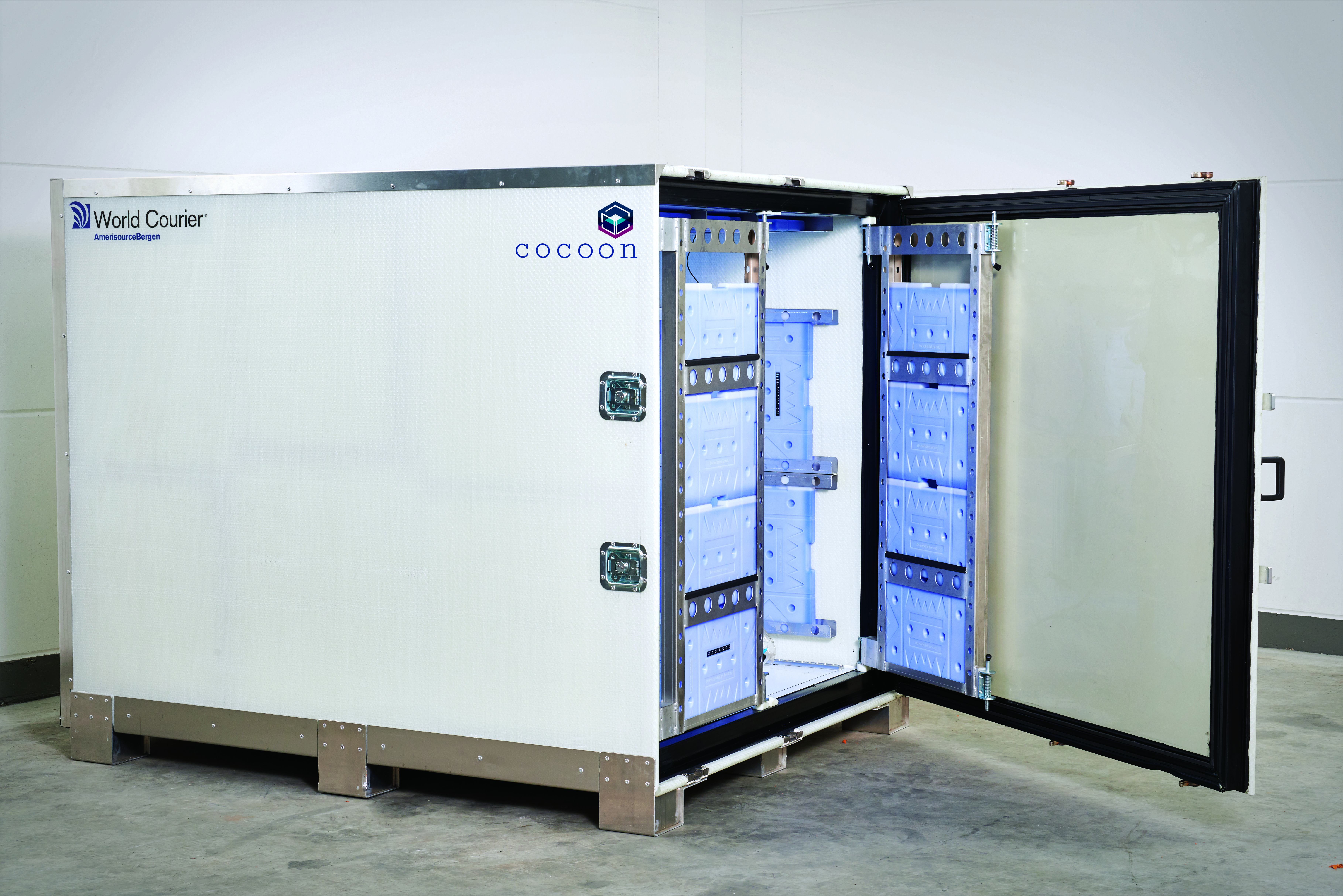 A cocoon shipping container with the door open, with cooling gel packs visible inside.