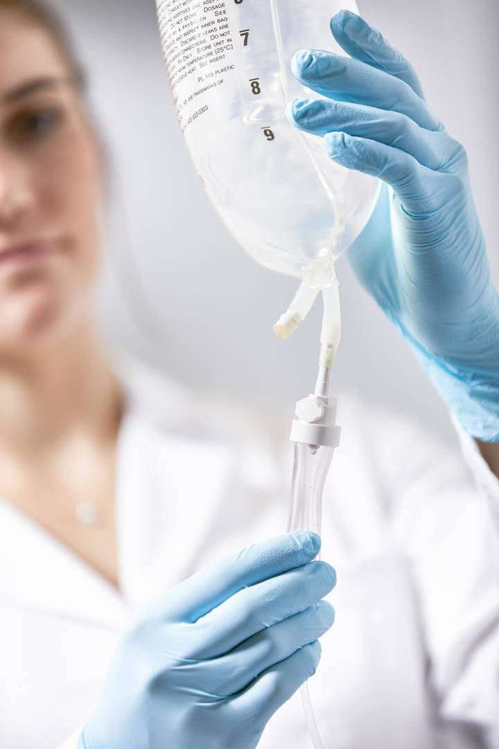 Nurse holding IV