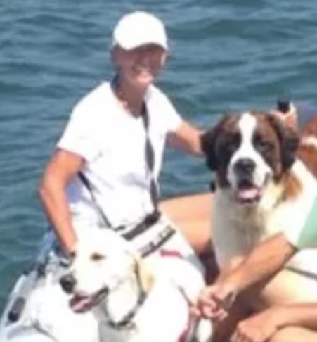 Julie Zitz on boat with dogs
